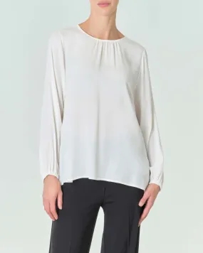 Blusa bianca con scollo tondo e polsini arricciati