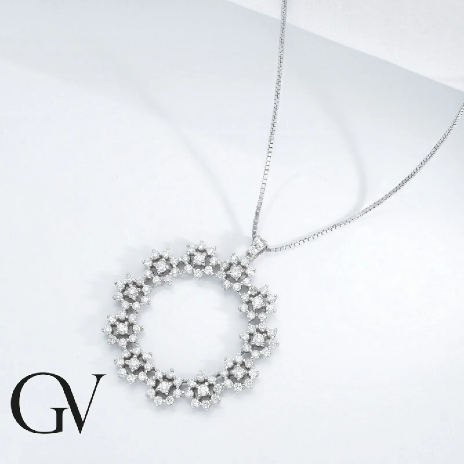 Collana in oro bianco 18k con pendente a stelline in diamanti